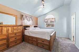 Master bedroom with walk-in-closet, master bath, and vaulted ceilings.