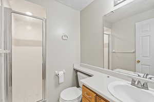 Downstairs bathroom with an enclosed shower.