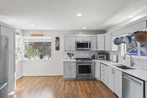 Remodeled kitchen, appliances with stainless steel finishes, ample counter space and mountain views from corner window.