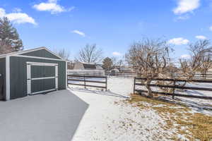 Shed and fenced separation portion of backyard.