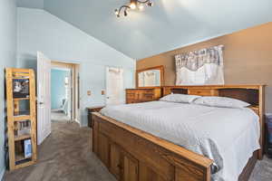 Master bedroom with walk-in-closet, master bath, and vaulted ceilings.