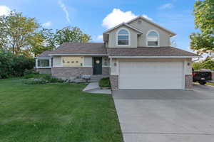 Front of property with 2 car garage and trailer parking