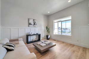 Living room with light hardwood / wood-style flooring