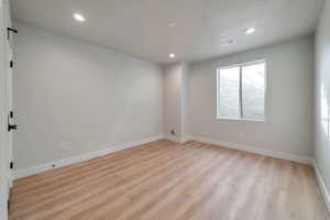 Spare room featuring light hardwood / wood-style floors