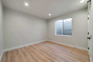 Empty room with light wood-type flooring