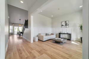 Living room with light hardwood / wood-style flooring