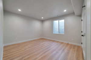 Unfurnished room featuring light wood-type flooring