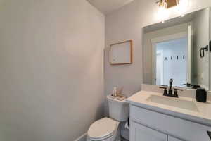 Bathroom featuring vanity and toilet