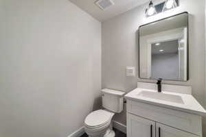 Bathroom with vanity and toilet