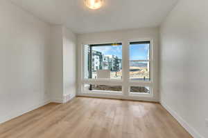 Spare room featuring light hardwood / wood-style floors