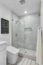 Primary Bathroom with upgraded tile shower, euro glass, and luxury bidet