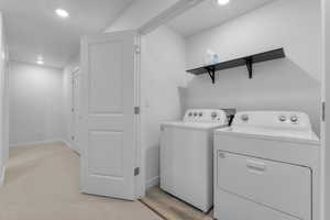 Laundry area featuring included washer and dryer