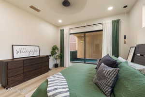 Bedroom featuring light wood-type flooring and access to outside