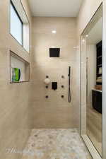 Bathroom featuring tiled shower