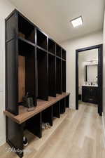 Mudroom with light wood-type flooring