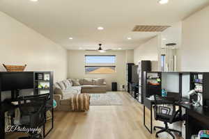 Office area featuring ceiling fan and light hardwood / wood-style flooring