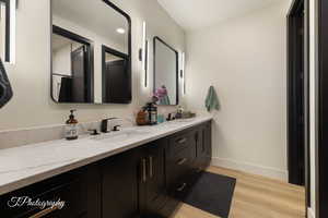 Bathroom with vanity and hardwood / wood-style floors