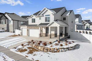 View of front of property with a garage