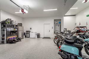 2 car side of 4 car garage with door to kitchen/mud room