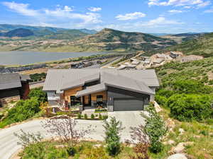 Exterior space with a water and mountain view