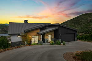 Contemporary house with a mountain view and a garage