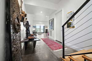 Foyer featuring concrete floors