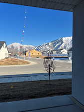 View of yard featuring a mountain view and covered porch large enough to place outdoor furniture and grill