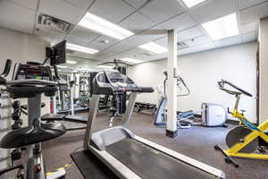 Workout area featuring a paneled ceiling