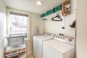 Laundry area with washer and dryer and a textured ceiling