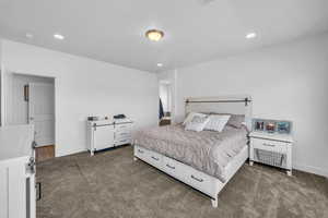 Bedroom with dark carpet