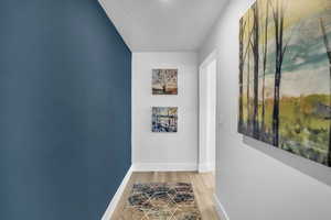 Hallway featuring hardwood / wood-style flooring