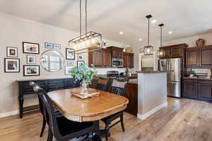 Dining space with light wood-type flooring