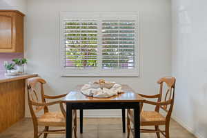 Tiled dining space with a wealth of natural light