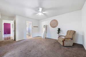 Unfurnished room with ceiling fan and carpet flooring