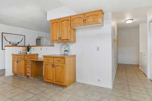 Kitchen with light tile patterned floors