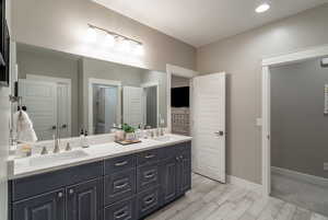 Bathroom with vanity and hardwood / wood-style floors