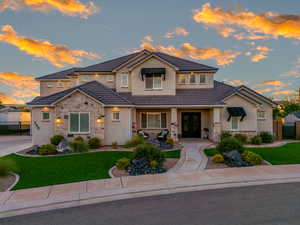 View of front of home featuring a lawn