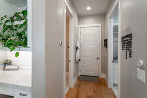 Doorway to outside with light hardwood / wood-style flooring