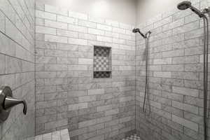 Bathroom featuring tiled shower