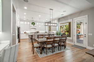 Dining area with sink and light hardwood / wood-style floors