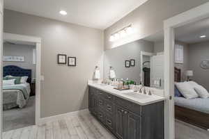 Bathroom with vanity and hardwood / wood-style floors