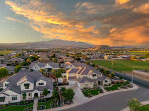 Aerial view at dusk featuring a mountain view