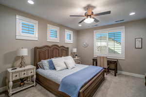 Bedroom with light carpet and ceiling fan