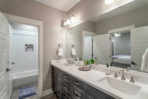 Bathroom featuring ceiling fan and vanity