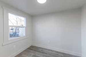 Empty room with light wood-type flooring