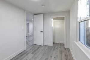 Unfurnished bedroom featuring light hardwood / wood-style floors