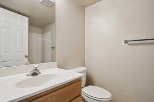 Bathroom with toilet and vanity