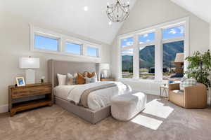 Carpeted bedroom featuring an inviting chandelier, a mountain view, and high vaulted ceiling