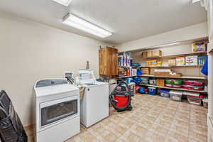 Laundry area with washing machine and clothes dryer