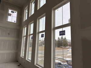 Entryway featuring a healthy amount of sunlight and a high ceiling